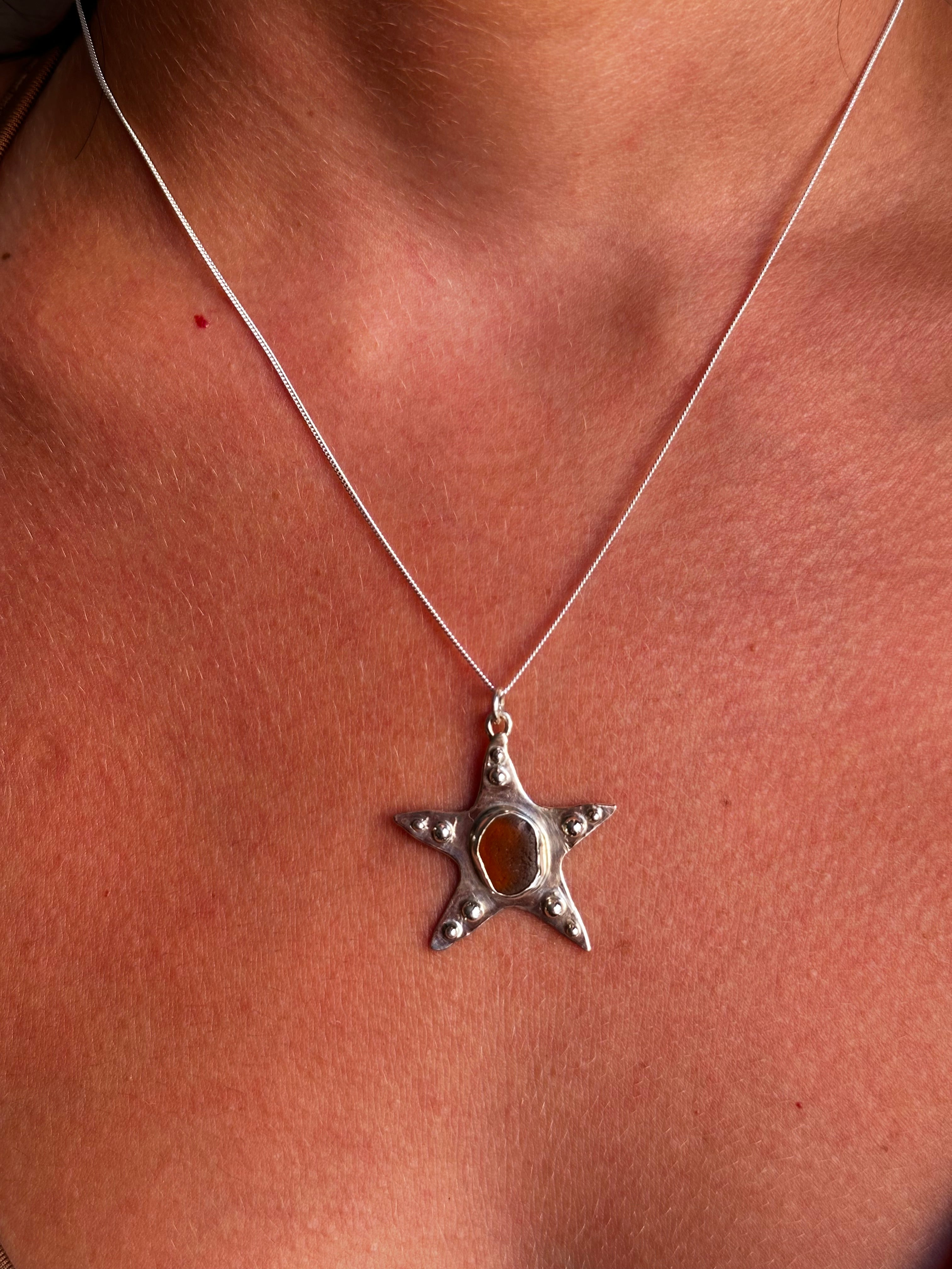 COLGANTE ESTRELLA DE MAR ÁMBAR